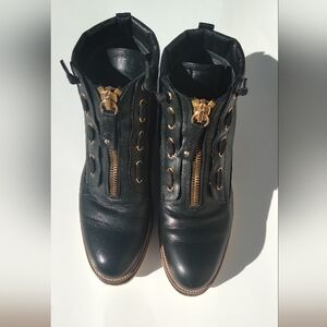 Elegant Black Leather Combat Boots with Gold Zipper